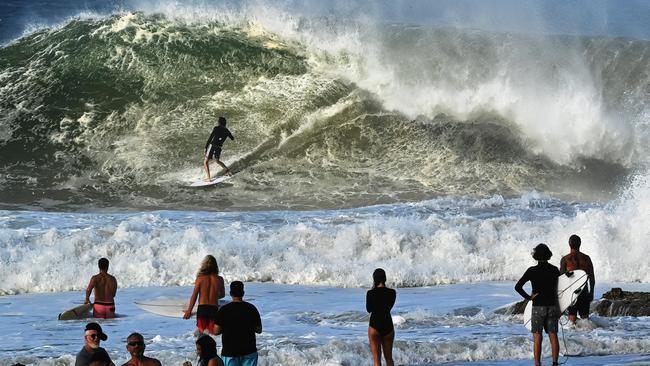 Surfers at Snapper Rocks enjoy the large swell, strong winds and big waves caused by Ex-tropical Cyclone Seth as it moves down the coast north east of the Gold Coast. Picture: Lyndon Mechielsen/The Australian.