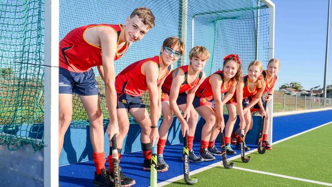 L-R: Joshua Ucinek, Owen Geoghegan, Coell Williams, Molly Dwyer, Emily Holland, Ella Bruce at West Beach, who are part of the National Under-15 hockey championships, Tuesday, April 6, 2021. Picture: Brenton Edwards