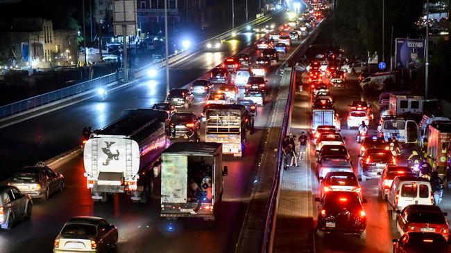 Vehicles move along a congested highway along the southern entry to Beirut as families flee the Israeli strikes. Picture: AFP.