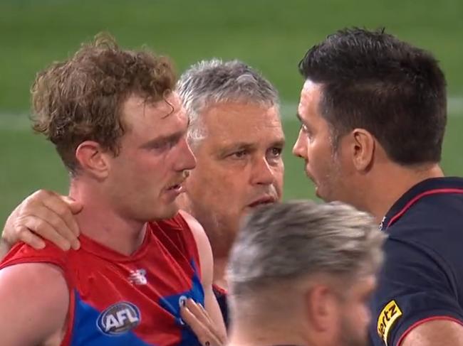 Harrison Petty consoled by his teammates and coaches. Photo: Channel 7