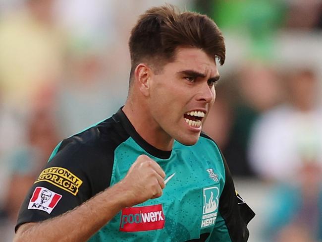 MELBOURNE, AUSTRALIA - DECEMBER 18: Xavier Bartlett of the Heat celebrates the wicket of Tom Rogers of the Stars during the BBL match between Melbourne Stars and Brisbane Heat at Melbourne Cricket Ground, on December 18, 2024, in Melbourne, Australia. (Photo by Morgan Hancock/Getty Images)