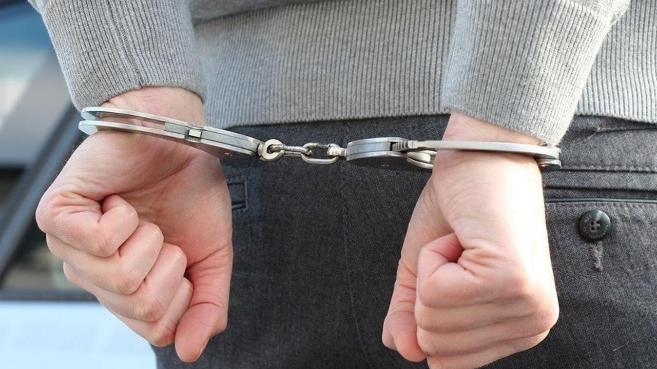 The man is accused of kicking and spitting on police when arrested in Toowoomba at the weekend.