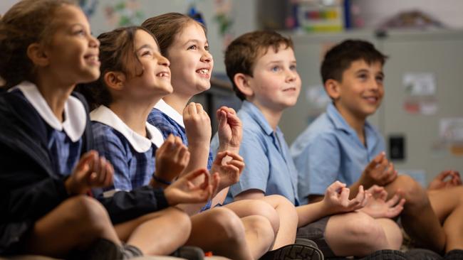 L-r  Gigi, 8, Sienna, 8, Mikaela, 8, Andy, 9 and Joshua, 9. St. John Bosco's Primary School has a program that teaches kids mindfulness to boost their mental health. Picture: Jason Edwards  St. John Bosco's Primary School has a program that teaches kids mindfulness to boost their mental health. Picture: Jason Edwards