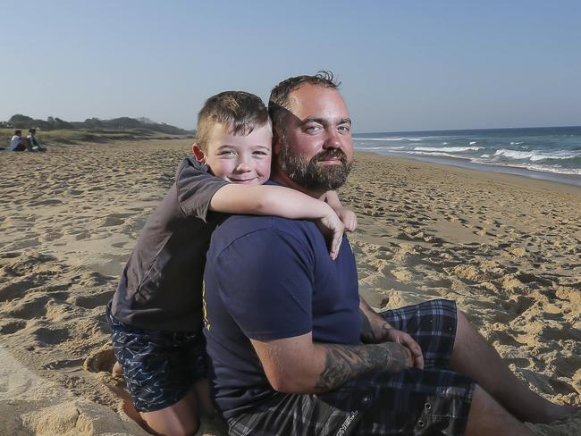 "DO NOT USE - ON HOLD FOR PRIDE OF AUSTRALIA LAUNCH" - Julian Hohnen 7yrs and his dad Maike. The two & a friend were forced to tread water for 6hrs until they were rescued, 15km off Caloundra after their boat sank earlier this year. Julian is nominated for Pride, he showed great courage and barvery for a little guy and kept his dad and friend calm during the ordeal.  Pic Mark Cranitch.