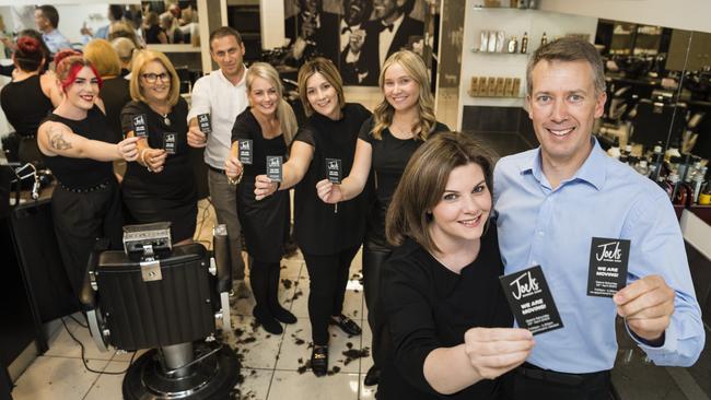 Susan and Joel Watson and the team from Joel's Barber Shop (back, from left) Simone Roache, Robyn Partridge, Ahmet Koysu, Chloe Handley, Talia Maculan and Anna Theodosis are packing up the Margaret St shop and moving to a new venture at the Eastville Shopping Centre on the range, Wednesday, April 5, 2023. Picture: Kevin Farmer