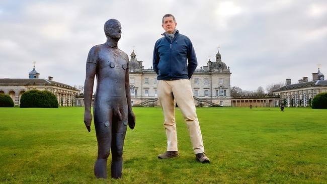 Antony Gormley with one of the Time Horizon statues in the grounds of Houghton Hall Picture: Pete Huggins