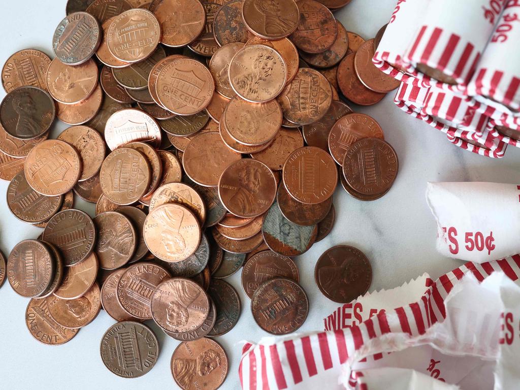 NEW YORK, NEW YORK - FEBRUARY 10: In this photo illustration, pennies are seen on a table on February 10, 2025 in New York City. U.S. President Donald Trump directed the Treasury Department to stop minting new pennies, citing the rising cost of producing the one-cent coin. Manufacturing costs for pennies is nearly $0.037 up from $0.031 the year before. (Photo illustration by Michael M. Santiago/Getty Images) (Photo by Michael M. Santiago / GETTY IMAGES NORTH AMERICA / Getty Images via AFP)