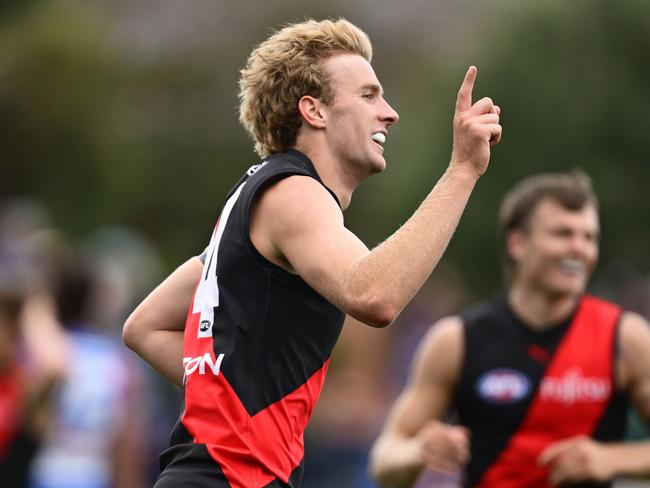 MELBOURNE, AUSTRALIA - FEBRUARY 15: Tom Edwards of the Bombers celebrates kicking a goal during the 2025 AFL Pre-Season match between Western Bulldogs and Essendon Bombers at Whitten Oval on February 15, 2025 in Melbourne, Australia. (Photo by Quinn Rooney/Getty Images)