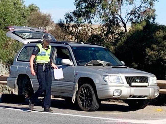Police major crash investigators at the scene of an accident where a person was changing a tyre on the side of the Port Expressway at Wingfield when they were hit by a car. Picture: George Yankovich