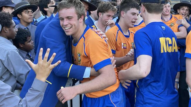 Marist College Ashgrove flanker Harry Thompson is congratulated by school mates.