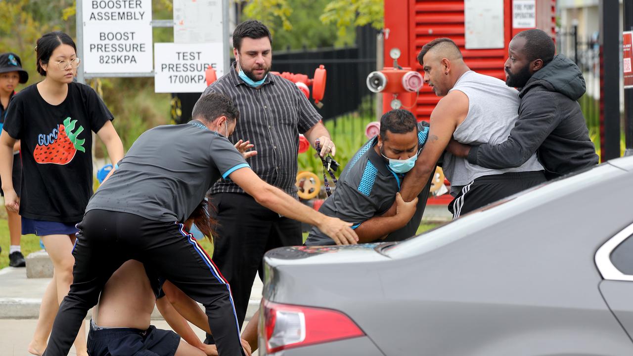 School staff and other parents stepped in to break up the fight. Picture: Toby Zerna