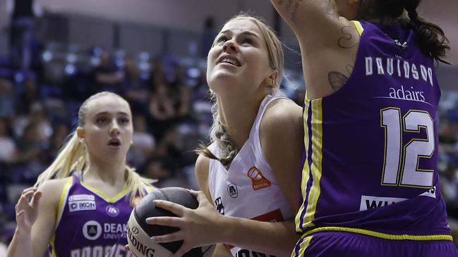 MELBOURNE, AUSTRALIA - DECEMBER 20: Isla Juffermans of the Flames shoots under pressure from Penina Davidson of the Boomers during the WNBL match between Melbourne Boomers and Sydney Flames at Melbourne Sports Centres - Parkville, on December 20, 2023, in Melbourne, Australia. (Photo by Daniel Pockett/Getty Images)