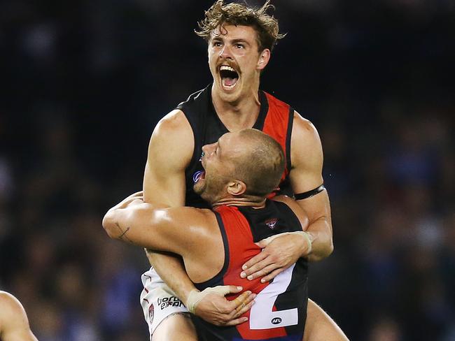 MELBOURNE, AUSTRALIA - APRIL 19: Joe Daniher of the Bombers celebrates a goal with Orazio Fantasia of the Bombers (R) during the round 5 AFL match between North Melbourne and Essendon at Marvel Stadium on April 19, 2019 in Melbourne, Australia. (Photo by Michael Dodge/Getty Images)