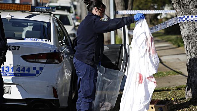 Police bagging evidence at the crime scene at Wall Avenue, Panania, where Abounader was shot dead. Picture: Adam Yip