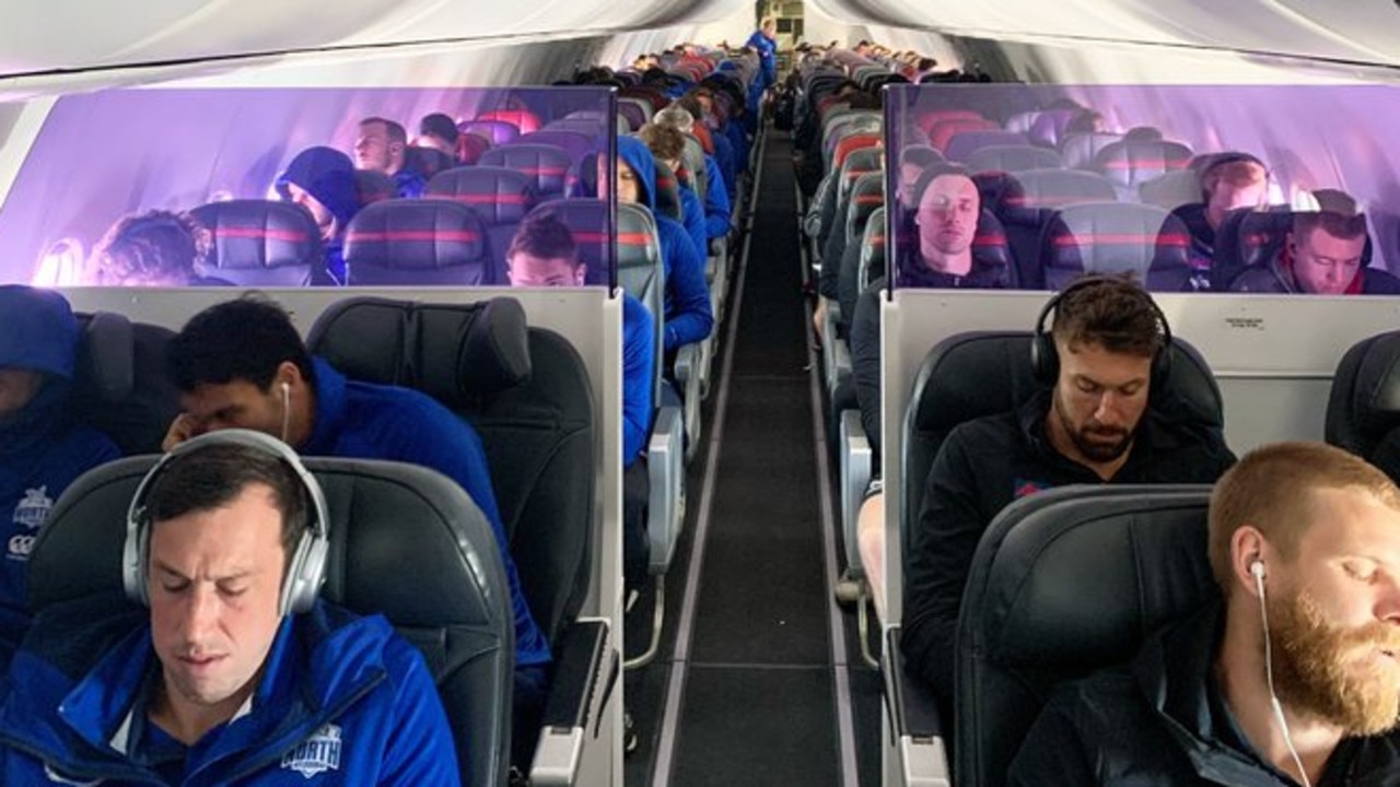 North Melbourne and Essendon players sharing a flight to Sydney. Photo: North Melbourne FC/Twitter