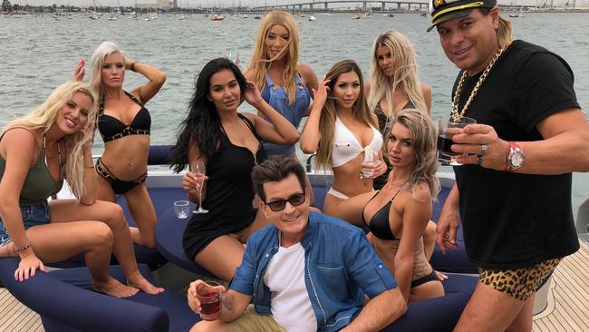 On the set of the Ultra Tune ad in Melbourne starring Charlie Sheen are (from left) Tyana Hansen, Haylee Baxter, Parnia Porsche, Charlie Sheen, Laura Lydall, Michelle Kimberlee, Imogen Lovell (back row, far right), Giuliana Migliorini and Warwick Capper. PICTURE: Arthur St John