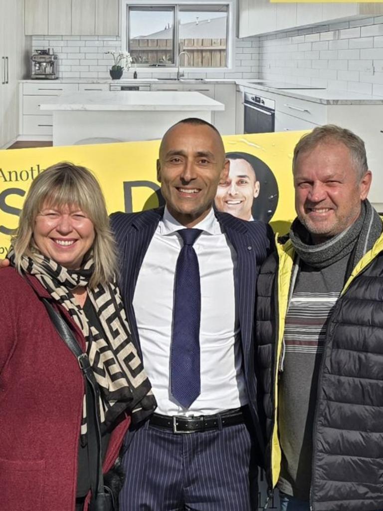 Ray White Gladstone Park director Malek Younan with the happy new owners.