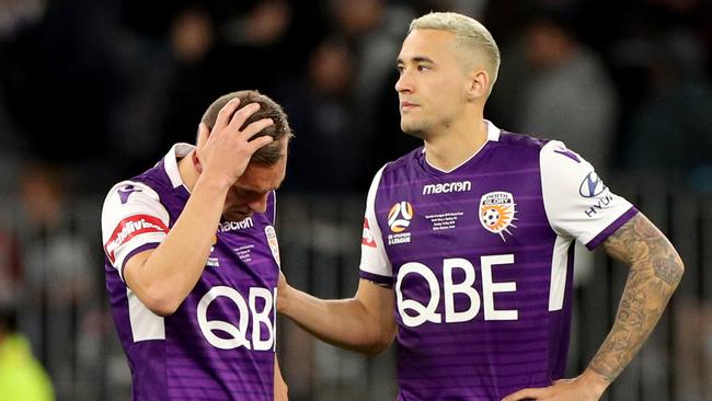 Santalab (left) is consoled by Glory teammate Jason Davidson. Picture: AAP