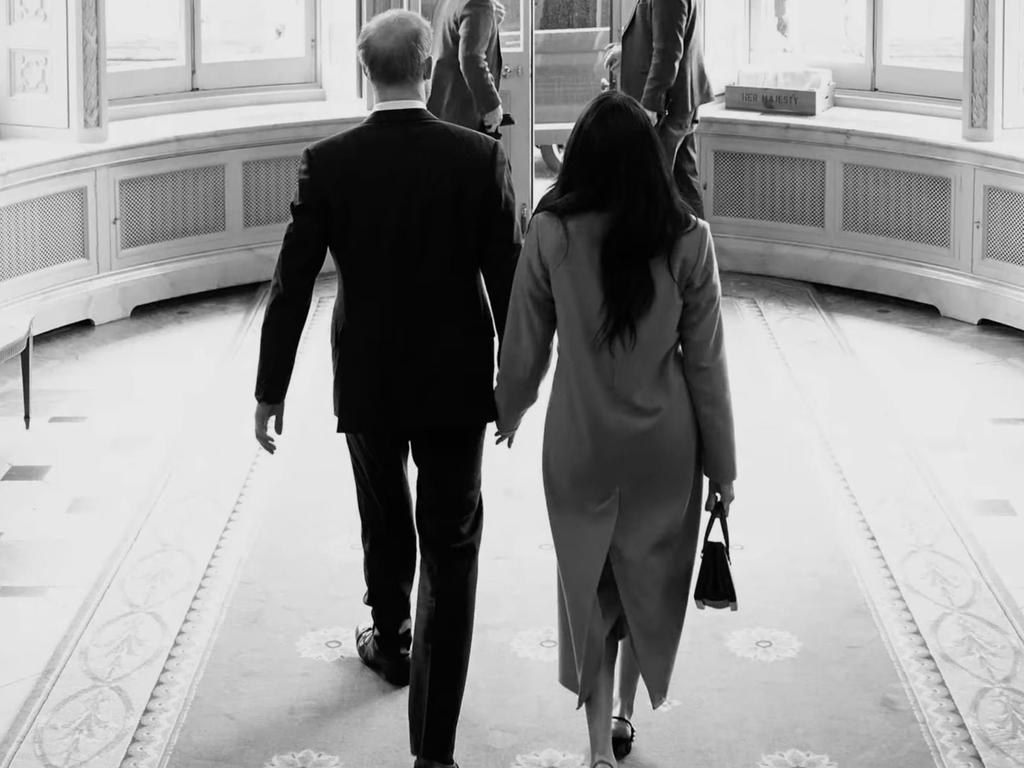 The couple exits Buckingham Palace through the garden entrance. The photo was taken during their farewell tour on March 5, 2020. Picture: Netflix