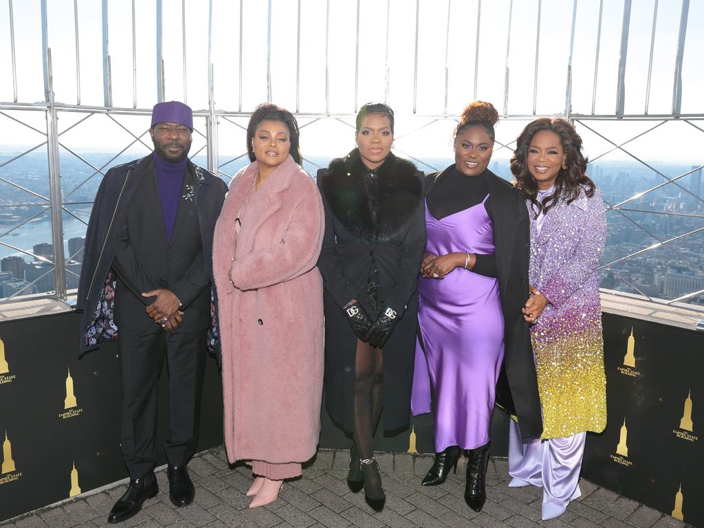 The Color Purple stars (left to right) Blitz Bazawule, Henson, Fantasia Barrino, Danielle Brooks, and Oprah Winfrey at the Empire State Building in celebration of the film's premiere on December 12, 2023 in New York City. Picture: Dimitrios Kambouris/Getty Images