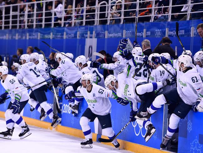 Team Slovenia rushes the ice after an overtime win of a men’s preliminary round ice hockey match between the United States and Slovenia during the Pyeongchang 2018 Winter Olympic Games at the Kwandong Hockey Centre in Gangneung, South Korea on February 14, 2018. Picture: AFP