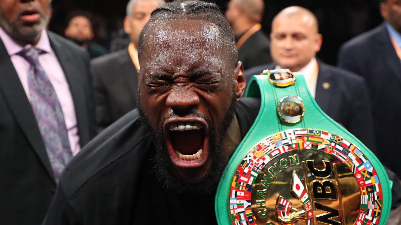Deontay Wilder celebrates after knocking out Dominic Breazeale in the first round.