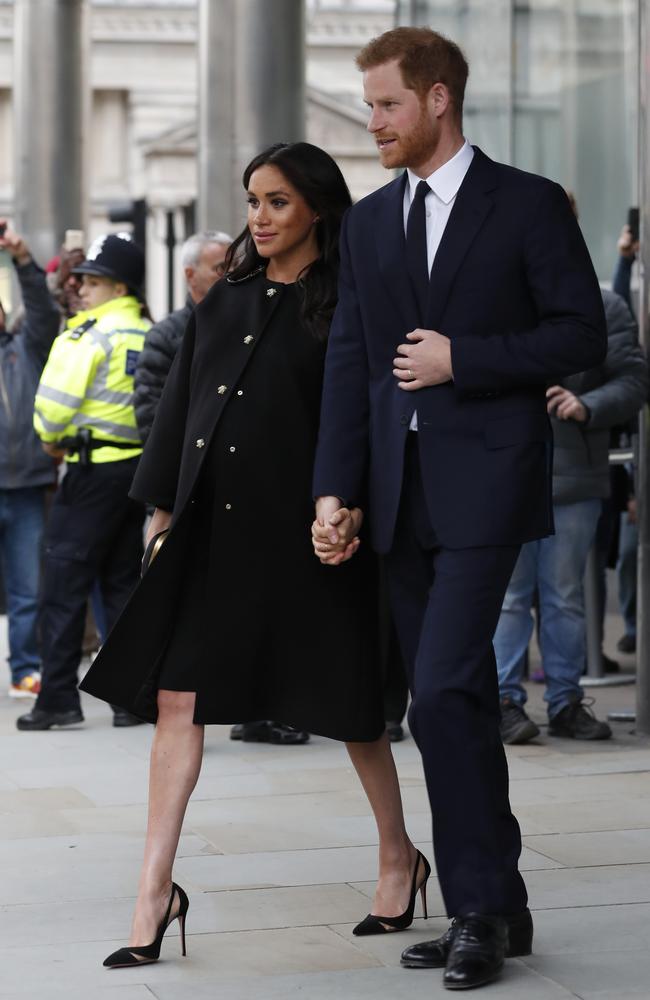 New claims about the Duchess of Sussex, left, with her husband Prince Harry, have been made in a documentary. Picture: AP Photo/Alastair Grant