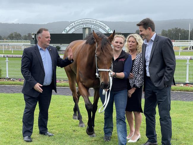 Central Coast Parliamentary Secretary Adam Crouch, trainer Angela Davies and Racing Minister Kevin Anderson at the announcement on Monday.