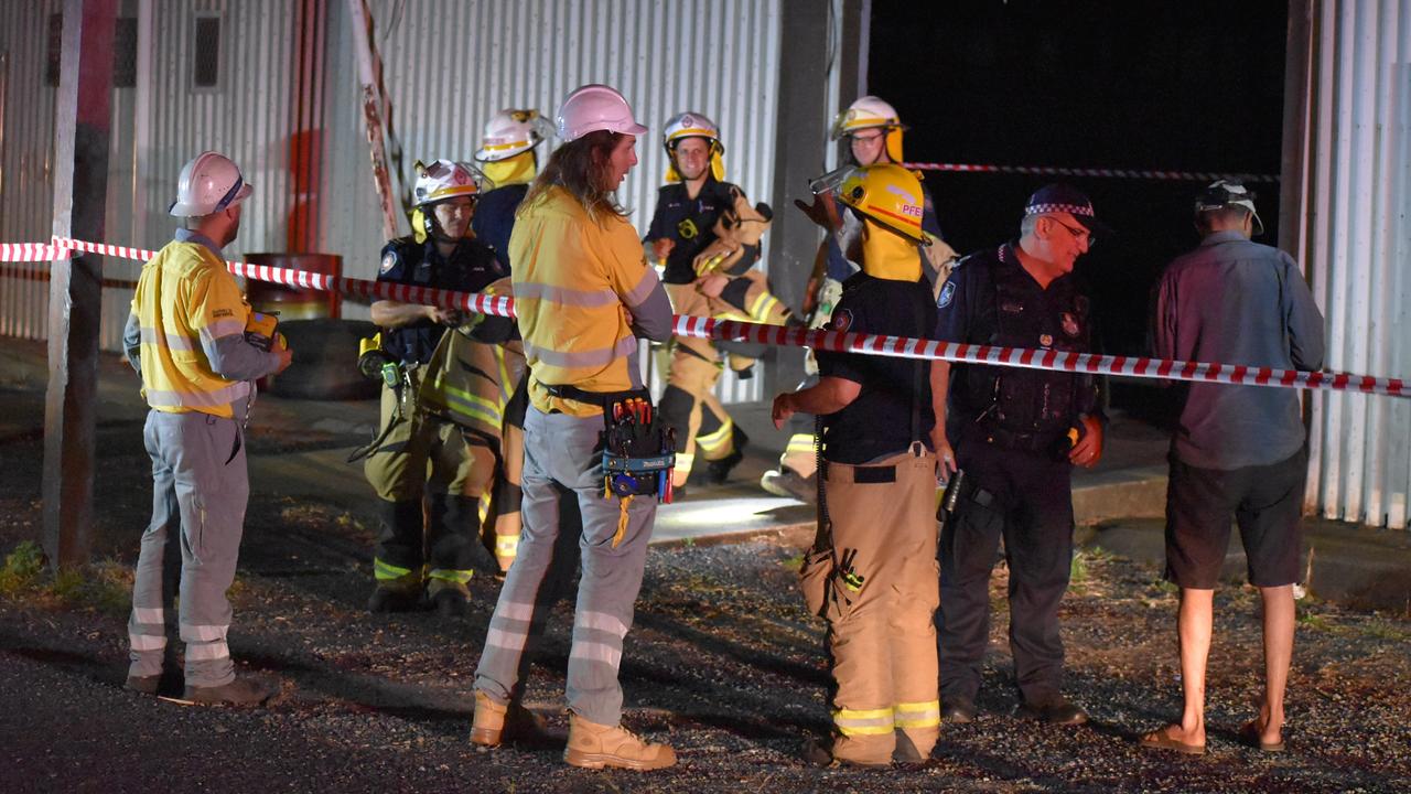 Firefighters and police assess the scene of a building collapse along River Street in Mackay CBD. A 15m by 15m part of the floor has fallen into the Pioneer River. Picture: Rae Wilson