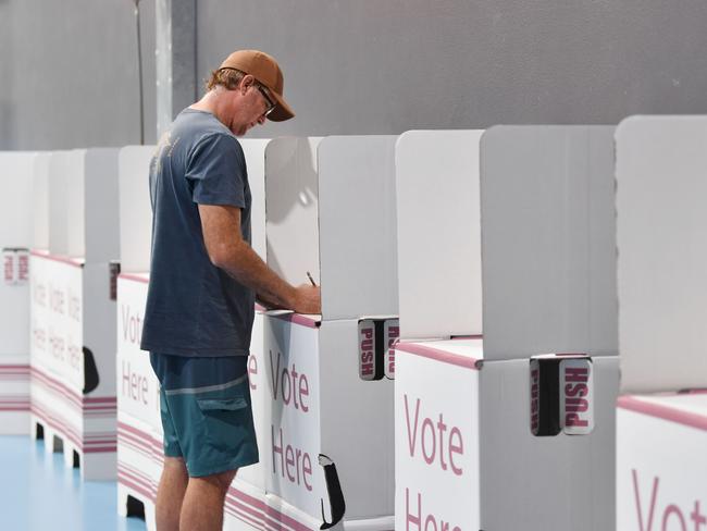 Gary Edwards from East Mackay fills out his vote card at the Victoria Park State School polling booth. Picture: Tony Martin