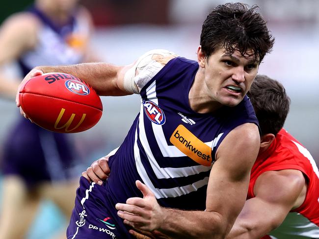 SYDNEY, AUSTRALIA - MAY 13: Lachie Schultz of the Dockers competes with Oliver Florent of the Swans during the round nine AFL match between Sydney Swans and Fremantle Dockers at Sydney Cricket Ground, on May 13, 2023, in Sydney, Australia. (Photo by Brendon Thorne/AFL Photos/Getty Images)