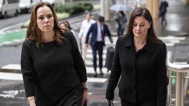 Former Super Retail Group executives turned whistleblowers Rebecca Farrell, left, and Amelia Berczelly, right, walking to Federal Court last year in Sydney. Picture: Monique Harmer
