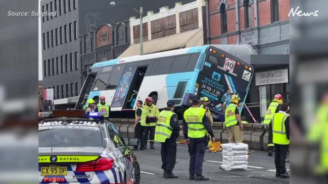 Bus collides with a car and tips over on a busy Inner West road