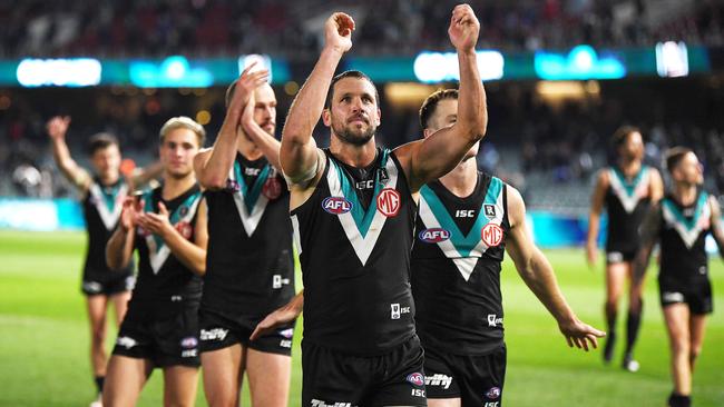 Travis Boak of Port Adelaide celebrates the win with the fans during the round 11 AFL match against the Richmond Tigers at Adelaide Oval. Picture: Mark Brake/Getty Images