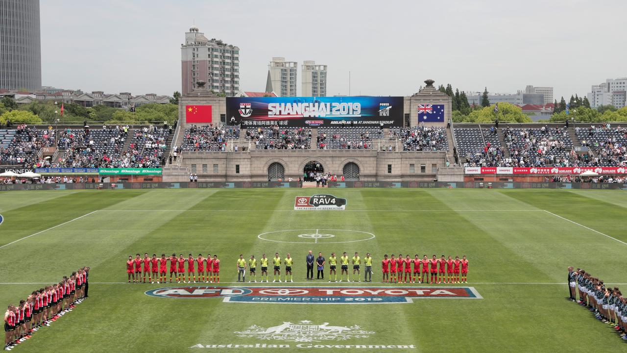 Players line up for the national anthem during last year’s match between St Kilda and Port Adelaide at Jiangwan Stadium, Shanghai. Picture: Michael Willson/AFL Photos