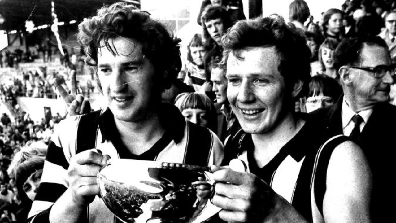 Glenorchy playing-coach Peter Hudson holding the 1975 premiership cup with Glenorchy captain Darryl Sutton.