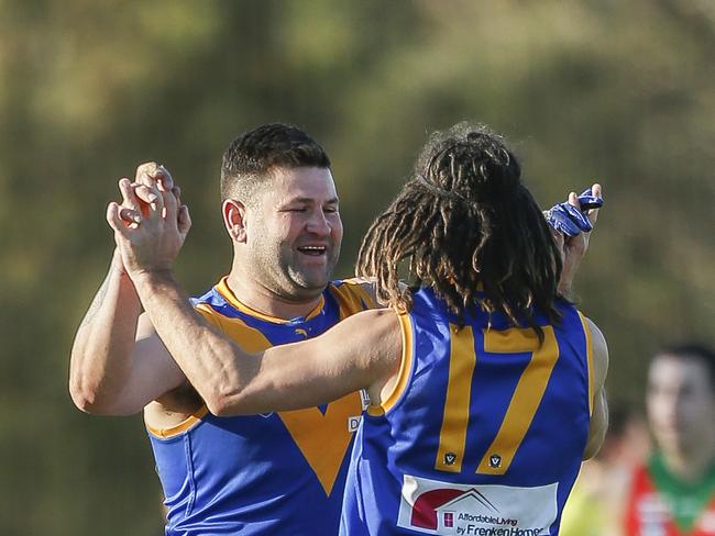 Football SEFNL: Cranbourne v Tooradin-Dalmore. Cranbourne full-forward Marc Holt (the big man) needs 8 goals to reach 1000 career goals. He made it 999. Picture: Valeriu Campan