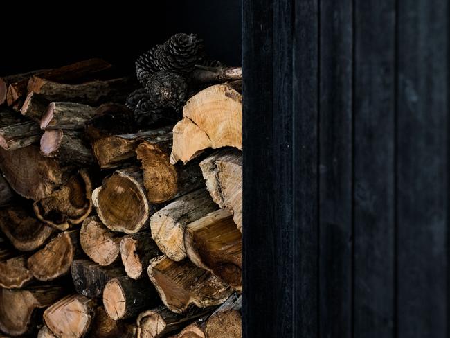 The generous, neatly stacked firewood and pile complete with pinecones at Kittawa Lodge on King Island. Picture: ADAM GIBSON