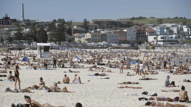 Bondi Beach was closed warm weather brought out thousands of sun seekers. Photographer: Adam Yip