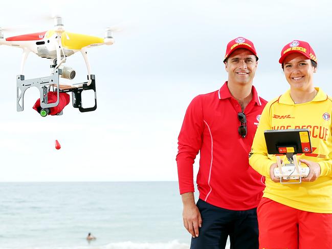 Surf Life Saving Australia’s chief drone pilot Tom Caska and drone pilot Sally Mac with a Westpac Life Saver Rescue Drone at Mona Vale Beach. Picture: Tim Hunter