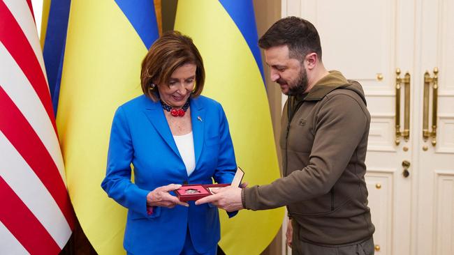 Ukraine President Volodymyr Zelensky presents the Order of Princess Olga to US Speaker of the House of Representatives Nancy Pelosi during their meeting in Kyiv this month. Picture: AFP