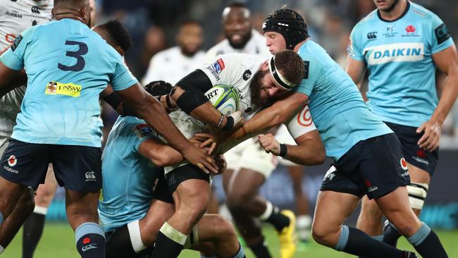 Waratahs players tackle Sharks prop Thomas du Toit. Picture: Getty Images 