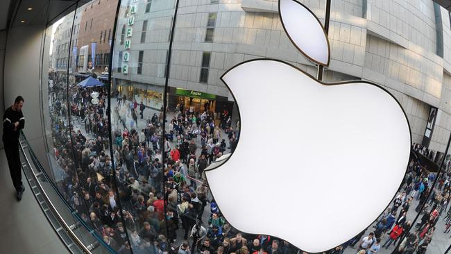 Customers queue for Apple products outside an Apple store in the southern German city of Munich. Apple has “the most loyal customer base in the world”, says US analyst, Dan Ives. Picture: AFP