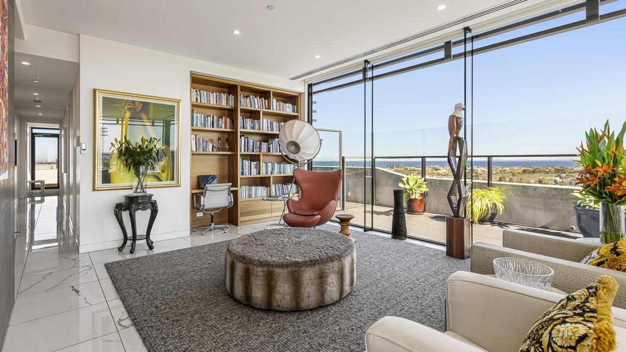 Walls of double-glazing connect to the terrace.