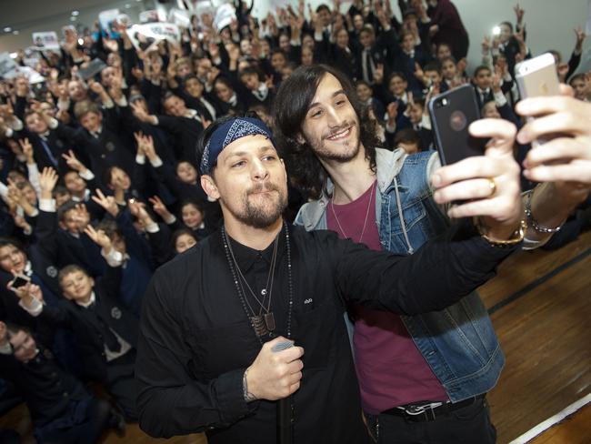 Joel Madden and Frank Lakoudis snap a selfie inside St Euphemia College in Bankstown. Picture: Melvyn Knipe