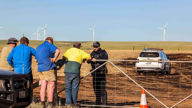 Police and locals at the crash scene in a paddock on Mumfords Rd, Redhill. Picture: Russell Millard Photography