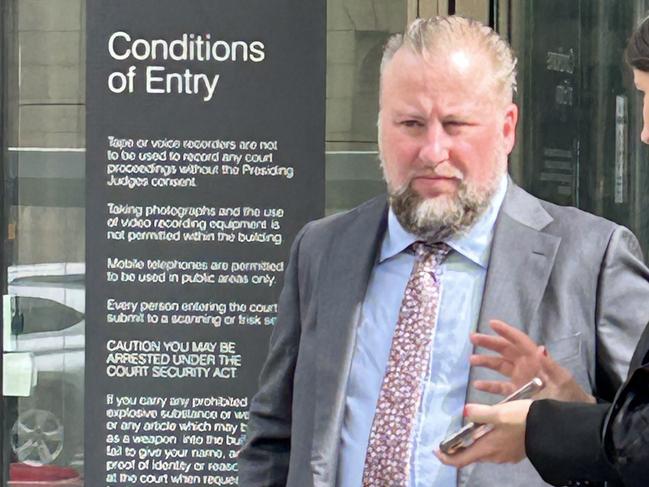 Rail Projects Victoria Metro Tunnel's creative strategy lead Luke Diggins outside County Court after being released on a recognizance release order.