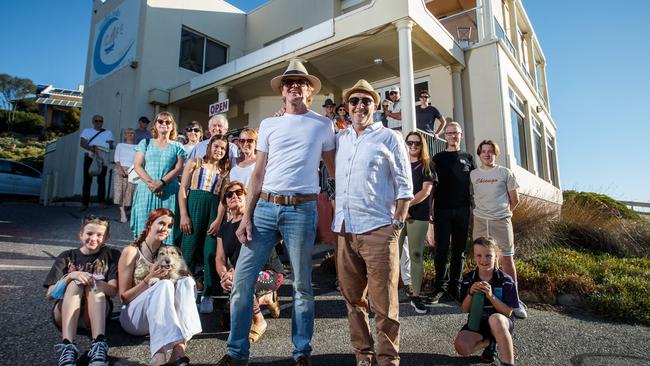 David Bagshaw and Kayne Ensten with members of a community group at the Marino Rocks Cafe in Marino, Adelaide on March 25, 2022. Picture Matt Turner.