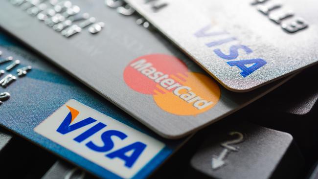 Bangkok, Thailand - Jun 23, 2015 : Group of credit cards on computer keyboard with VISA and MasterCard brand logos