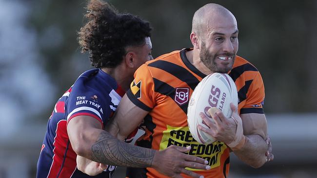 Michael Oldfield (right) of the Southport Tigers is challenged by Cruz Lazike of Runaway Bay Seagulls during the Rugby League Gold Coast minor semi final played at Owen Park, Southport, Gold Coast, Sunday, August, 28, 2022. Photo: Regi Varghese